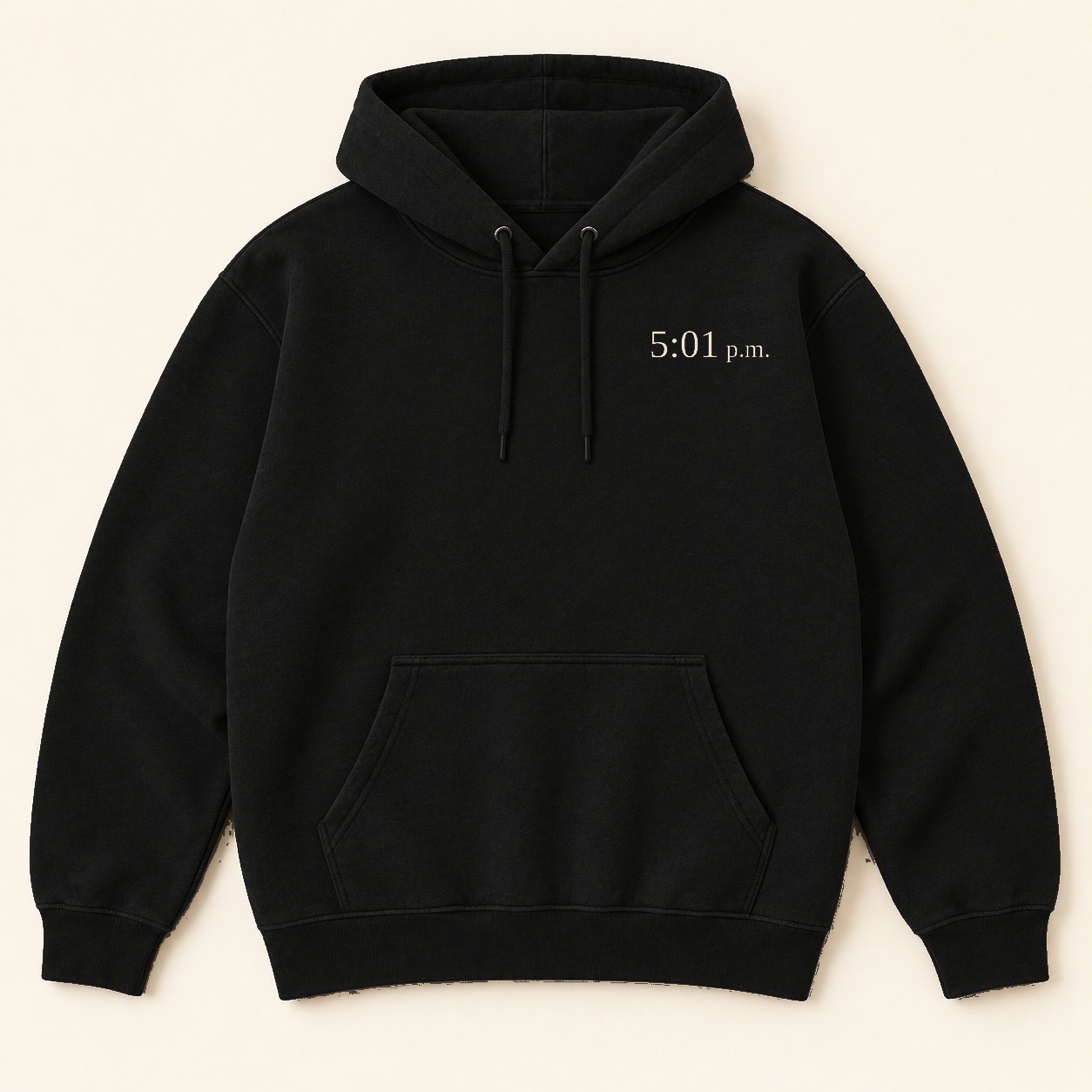 Black hoodie front design concept with small cream 5:01 p.m. text on the left chest